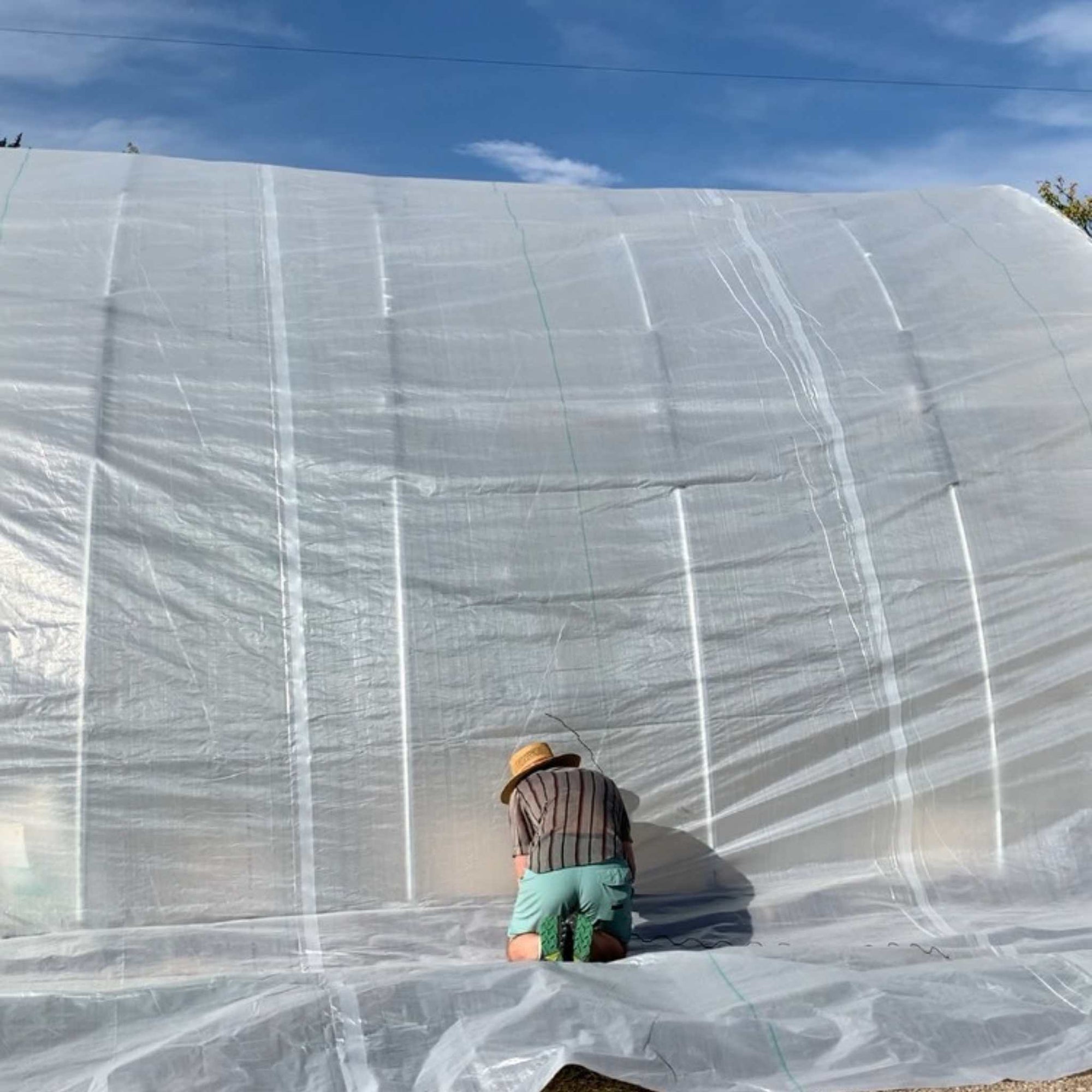 Grower Installing Solarig on Greenhouse Structure