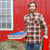 Veteran farmer holding stack of heroes collection trays